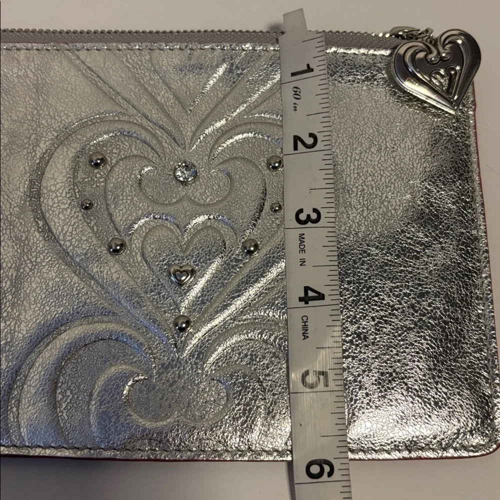 BRIGHTON SILVER METALLIC WRISTLET WITH SOME BLING ON ONE SIDE PLAIN ON THE OTHER